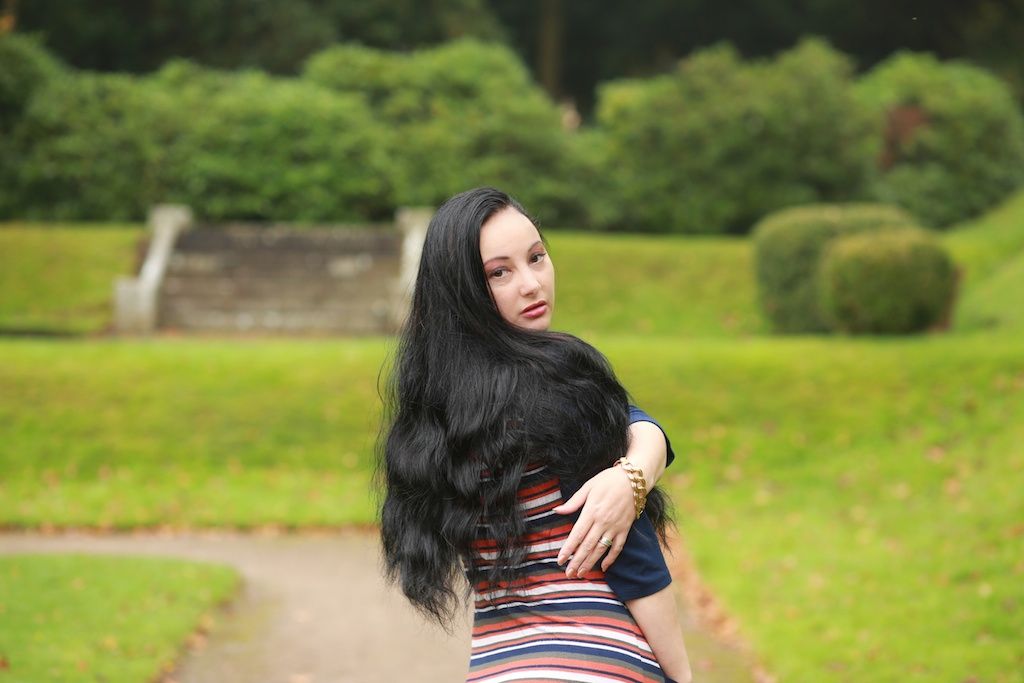in the park model wih very long black hair