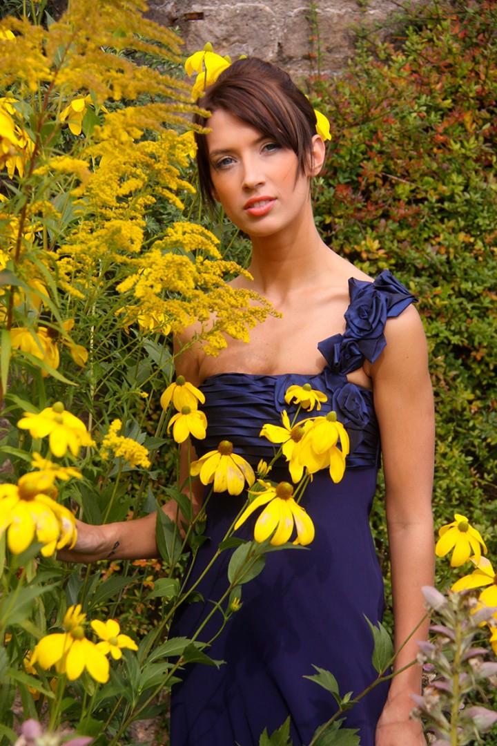 Young female model posing in a beautiful garden