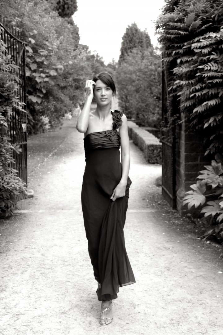 Young female model in long evening dress